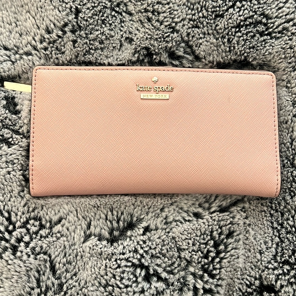 Kate spade baby pink wallet with black and white striped interior